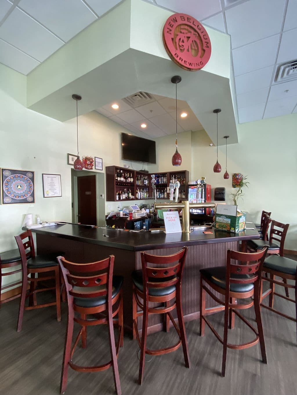 The bar area with bar stools and the KTM logo overhead